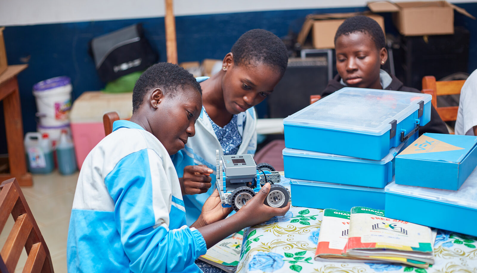 Close-up of an Achievers Ghana mentor and student discussing schoolwork